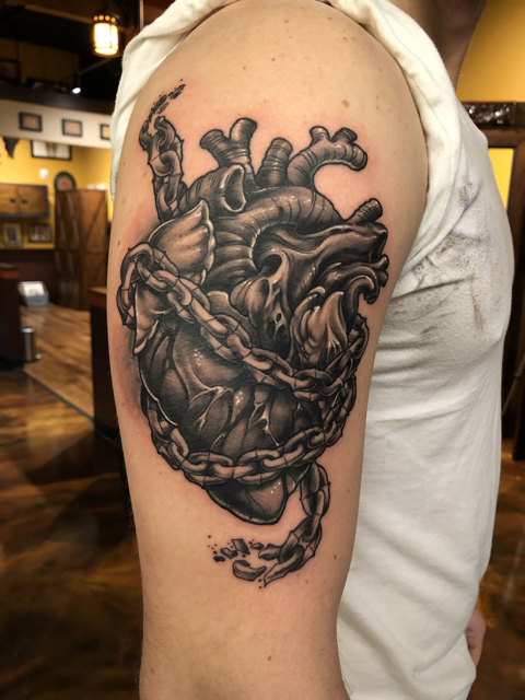 Ship chest piece tattoo framed in classic flowers and birds Eagle chest by Honest John of Highmark Tattoo Studio, Lynnwood, WA.