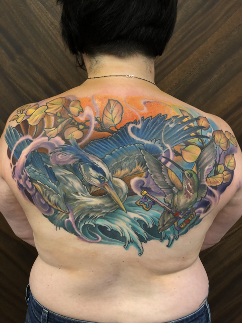 Blue whale with grey surf background tattoo by John Fitzgerald of Highmark Tattoo Studio in Lynnwood, WA.