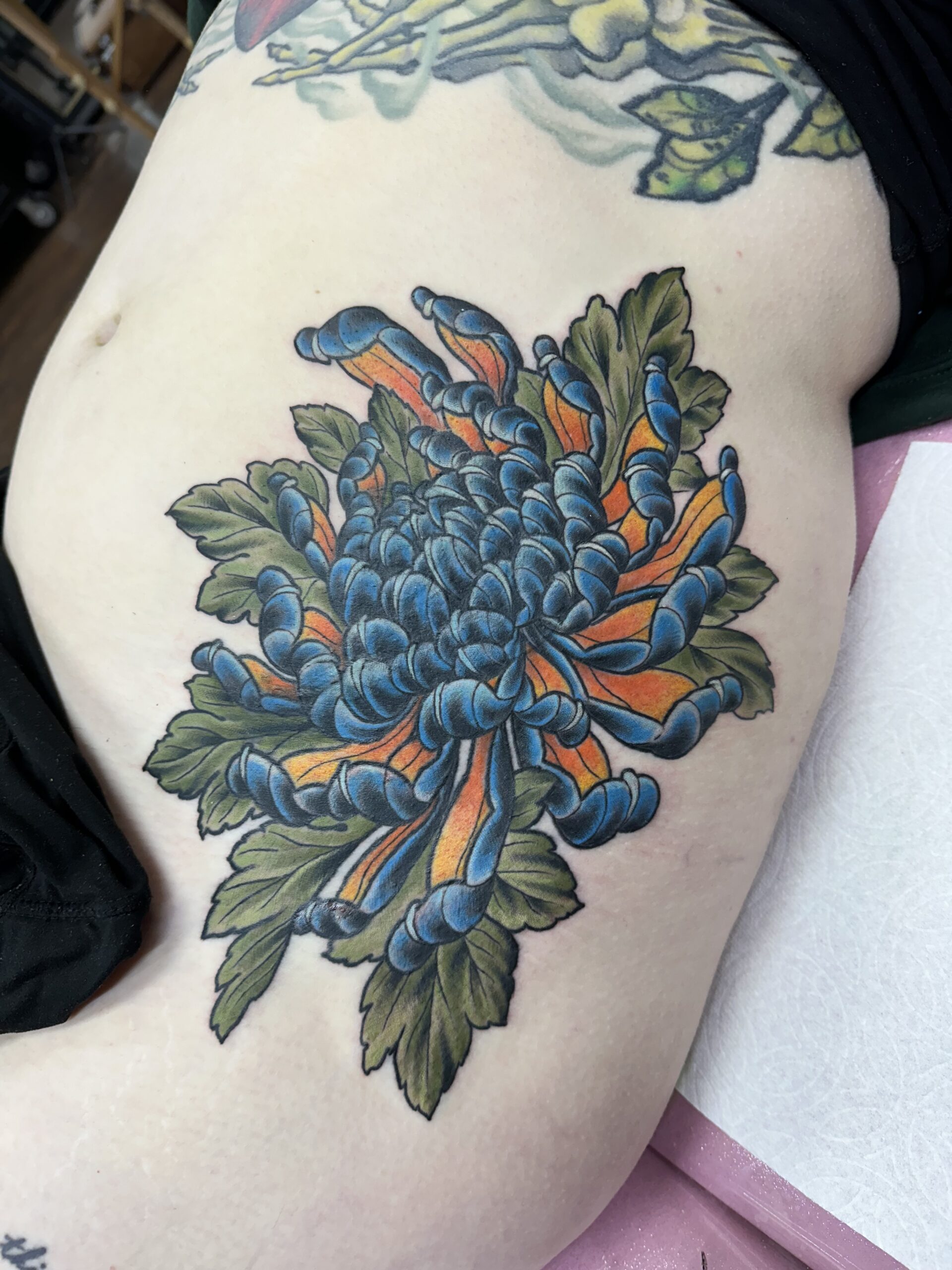 His and hers skull tattoos by John Fitzgerald of Highmark Tattoo in Lynnwood, WA. 