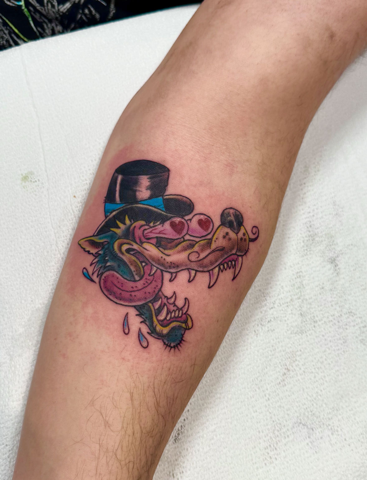 Black and white shull with a sword running through the crown exiting the throat tattoo available during Flash Tattoo events at Highmark Tattoo in Lynnwood, WA