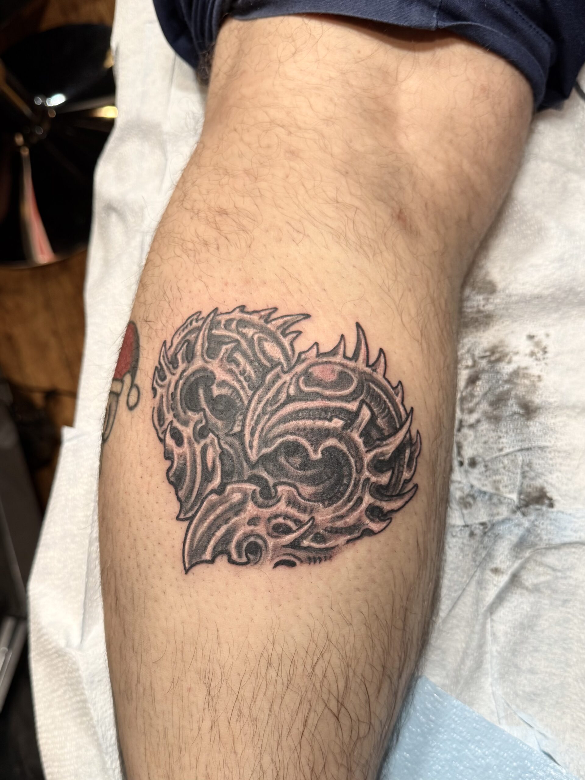 Black and white winged skull tattoo available during Flash Tattoo events at Highmark Tattoo in Lynnwood, WA